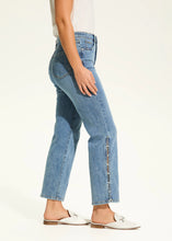 Load image into Gallery viewer, These fabulous jeans feature pearl embellishments along the side leg, adding a touch of elegance to their timeless design. With a high-rise waist and a straight-leg shape, they offer a flattering fit and classic style. The cropped length, with an inseam of 28 inches, makes them perfect for pairing with heels or flats. A perfect jean for the warmer months!