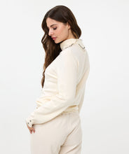 Load image into Gallery viewer, Elevate your wardrobe with the EsQualo Embellished Gem Collar Sweater. This stunning piece features a split turtleneck adorned with gem embellishments on both sides of the split collar, adding a touch of elegance and sophistication to your look. The sweater is designed with long sleeves, two floral gems on each cuff and a comfortable fit, making it perfect for both casual and dressy occasions.