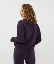 Load image into Gallery viewer, The EsQualo Embellished Sweatshirt is a stylish and comfortable piece. You won't believe the softness of this modal fabrication. It features a luxuriously soft feel and a classic round neck, making it perfect for cozy and stylish days. This sweatshirt has long sleeves and is embellished with shiny stones, adding a touch of elegance to your wardrobe.