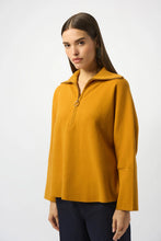 Load image into Gallery viewer, Woman wearing a mustard yellow long-sleeve top and navy pants against a white background.