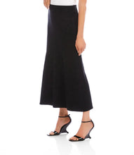 Load image into Gallery viewer, Long black skirt and black sandals worn by a model against a white background.