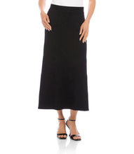 Load image into Gallery viewer, Long black skirt and black sandals worn by a model against a white background.