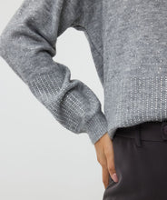 Load image into Gallery viewer, This chic sweater boasts a stylish grey color and is adorned with dazzling rhinestones on the bottom and sleeves, making it a standout piece. Its oversized fit pairs effortlessly with faux leather pants for an edgy, yet sophisticated look, or can be paired seamlessly with denim for a more polished casual style.