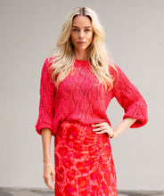 Load image into Gallery viewer, Crafted with intricate openwork details, this lightweight sweater is the perfect addition to any wardrobe. Its vivid, cheery color and classic round neckline make it a versatile piece that pairs well with white pants, shorts, or your favorite jeans. This gorgeous sweater offers both style and comfort.