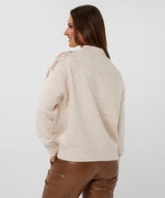 Load image into Gallery viewer, Beige sweater with rose gold sequin embellishments and brown leather pants against a plain background.