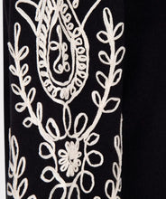 Load image into Gallery viewer, Our Sanne sweater is a work of art and a masterpiece of comfort and style. This black sweater features elegant puff sleeves and intricate cream stitching details. Crafted with anti-pilling acrylic, it promises durability and superior quality.