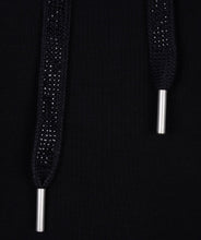 Load image into Gallery viewer, Close-up of black sequin drawstrings with silver metal tips against the black hoodie fabric.