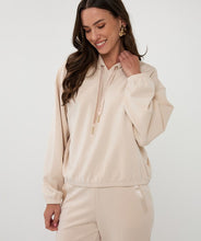 Load image into Gallery viewer, Woman wearing a beige hoodie and pants against a white background.
