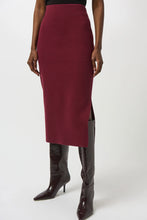 Load image into Gallery viewer, Woman wearing a burgundy pencil skirt and black knee-high boots against a white background.