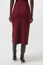 Load image into Gallery viewer, Woman wearing a burgundy pencil skirt and black knee-high boots against a white background.