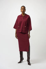 Load image into Gallery viewer, Woman wearing a burgundy outfit with a matching jacket and skirt against a white background.