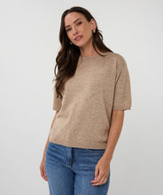 Load image into Gallery viewer, Woman wearing a taupe sweater and blue jeans against a white background.