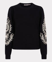 Load image into Gallery viewer, Our Sanne sweater is a work of art and a masterpiece of comfort and style. This black sweater features elegant puff sleeves and intricate cream stitching details. Crafted with anti-pilling acrylic, it promises durability and superior quality.