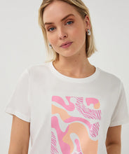 Load image into Gallery viewer, Woman wearing a white t-shirt with pink graphic design on a plain background.