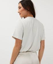 Load image into Gallery viewer, Elevate your wardrobe and sparkle with our Samia Short Sleeve Wide Fit Lurex T-Shirt, designed for women who value comfort and style. Made with a shimmering lurex fabric blend, this versatile top is a must-have for casual outings or dressed-up evenings. This t-shirt offers a flattering fit and just the right amount of shimmer.
Perfect as a spring fashion essential, pair this sparkling t-shirt with your favorite jeans or skirts for an effortlessly chic look and wear under a favorite blazer or cardigan.