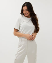 Load image into Gallery viewer, Elevate your wardrobe and sparkle with our Samia Short Sleeve Wide Fit Lurex T-Shirt, designed for women who value comfort and style. Made with a shimmering lurex fabric blend, this versatile top is a must-have for casual outings or dressed-up evenings. This t-shirt offers a flattering fit and just the right amount of shimmer.
Perfect as a spring fashion essential, pair this sparkling t-shirt with your favorite jeans or skirts for an effortlessly chic look and wear under a favorite blazer or cardigan.