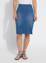 Load image into Gallery viewer, Crafted from 4-way stretch Knit Denim, the Tess Braided Denim Pencil Skirt boasts a knee-length design and boasts a patented waistband, sand blasting, and patch pockets. With princess seaming, a left-front vent, and hand braided details at the waist, this skirt is a true standout!
