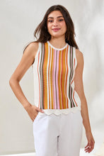 Load image into Gallery viewer, Woman wearing a sleeveless striped top with white pants against a plain background.