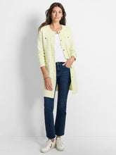 Load image into Gallery viewer, This eye-catching tunic-length jacket is the perfect addition to any outfit, whether paired with jeans or dressed up for a more elevated look. The interknit of pistachio and cream colors adds a vibrant touch, while the functional buttons add a touch of sophistication. The signature texture of the knit adds subtle contrast and depth to the overall appearance. It also features convenient pockets for added functionality.