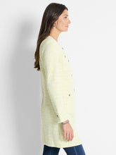Load image into Gallery viewer, This eye-catching tunic-length jacket is the perfect addition to any outfit, whether paired with jeans or dressed up for a more elevated look. The interknit of pistachio and cream colors adds a vibrant touch, while the functional buttons add a touch of sophistication. The signature texture of the knit adds subtle contrast and depth to the overall appearance. It also features convenient pockets for added functionality.