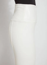Load image into Gallery viewer, These Vegan Leather leggings are made from stretchy Textured Faux Leather, boasting a body hugging fit and a concealed signature waistband that offers a smooth, flattering silhouette. In a versatile off-white hue known as chalk, they complement a wide array of your preferred tops beautifully.