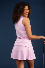 Load image into Gallery viewer, This classic sleeveless polo pairs perfectly with our skorts for golf, tennis, pickleball, and everything in between. Made from S & Q's Signature Stretch fabric, it's wrinkle-resistant and machine washable, ensuring both comfort and practicality. The vibrant orchid color adds a pop of color to your wardrobe, making it a must-have for any occasion.