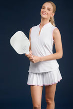 Load image into Gallery viewer, We love a classic pleated sport look! The Gwen Skort combines retro-inspired style with modern performance. This 15" high-waisted skort features attached compression undershorts with pockets, ensuring both comfort and practicality. Made from S&Q's Signature Italian Matte Stretch fabric, it's machine washable and wrinkle-resistant, making it perfect for golf, tennis, and other activities. Elevate your activewear collection with this chic and functional skort.