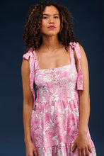 Load image into Gallery viewer, Elevate your spring wardrobe with The Sage Dress in Petunia Patisserie. This best-selling dress, now available in S & Q's Signature Matte Italian Stretch fabric, offers unparalleled comfort and a perfect fit. The stunning drop waist design features adjustable tie straps at the arms, providing both style and versatility. The wrinkle-resistant and machine washable fabric ensures you look fabulous all day long. Perfect for any occasion, this pink and white dress is a must-have addition to your collection.