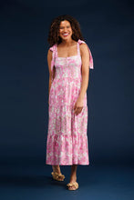 Load image into Gallery viewer, Elevate your spring wardrobe with The Sage Dress in Petunia Patisserie. This best-selling dress, now available in S & Q's Signature Matte Italian Stretch fabric, offers unparalleled comfort and a perfect fit. The stunning drop waist design features adjustable tie straps at the arms, providing both style and versatility. The wrinkle-resistant and machine washable fabric ensures you look fabulous all day long. Perfect for any occasion, this pink and white dress is a must-have addition to your collection.