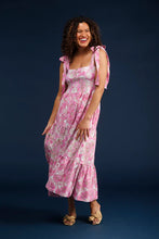 Load image into Gallery viewer, Elevate your spring wardrobe with The Sage Dress in Petunia Patisserie. This best-selling dress, now available in S & Q's Signature Matte Italian Stretch fabric, offers unparalleled comfort and a perfect fit. The stunning drop waist design features adjustable tie straps at the arms, providing both style and versatility. The wrinkle-resistant and machine washable fabric ensures you look fabulous all day long. Perfect for any occasion, this pink and white dress is a must-have addition to your collection.