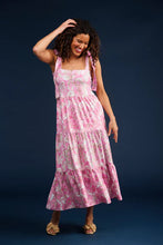 Load image into Gallery viewer, Elevate your spring wardrobe with The Sage Dress in Petunia Patisserie. This best-selling dress, now available in S & Q's Signature Matte Italian Stretch fabric, offers unparalleled comfort and a perfect fit. The stunning drop waist design features adjustable tie straps at the arms, providing both style and versatility. The wrinkle-resistant and machine washable fabric ensures you look fabulous all day long. Perfect for any occasion, this pink and white dress is a must-have addition to your collection.