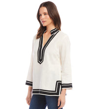 Load image into Gallery viewer, Channel your inner coastal elegance with this tunic's stylish grosgrain ribbon trim and relaxed silhouette, capturing the essence of effortless chic. The lightweight linen ensures optimal comfort, allowing you to embrace the warm breeze with ease, while the soft viscose adds a touch of refinement, ensuring a polished finish for any occasion. Color- Off white and black.