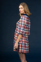 Load image into Gallery viewer, A perennial favorite with a fresh twist, the Tory Dress by Smith & Quinn returns in the breezy Coastal Plaid print. This tiered tunic silhouette features a relaxed fit, flattering V-neckline, and three-quarter puff sleeves for a touch of feminine charm. Crafted from S&Q Signature Stretch fabric, it offers breathable comfort, wrinkle resistance, and effortless polish—perfect for warm-weather outings, casual gatherings, or travel-ready style.