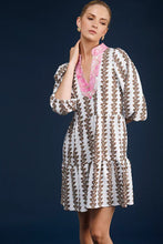 Load image into Gallery viewer, Step into timeless style with The Tory Dress in Coconut Vine by Smith & Quinn. This easy tiered tunic neck shift dress features 3/4 puff sleeves, adding a touch of sophistication to your wardrobe. Made from S&Q's Signature Stretch fabric, this dress is wrinkle-resistant and machine washable, ensuring both comfort and practicality. Perfect for any occasion, this dress is a must-have addition to your collection. Pair it with your favorite accessories for a chic and effortless look.