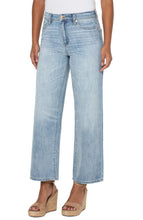 Load image into Gallery viewer, Meet The Tucker. The "Dad Jean" re-envisioned into a super cool girl jean. Loose and straight legged...clean, casual and tucked...always relaxed and cool. Give off a 90's vibe and pair them with some sneakers, chunky sandals or your favorite wedges! This modern eco jean was designed using new laser techniques and processes that gives the "Liverpool Look" and uses a fraction of our natural resources. Color -Animas; Light blue. 30'' Inseam. Hi-rise. Wide leg.