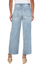 Load image into Gallery viewer, Meet The Tucker. The "Dad Jean" re-envisioned into a super cool girl jean. Loose and straight legged...clean, casual and tucked...always relaxed and cool. Give off a 90's vibe and pair them with some sneakers, chunky sandals or your favorite wedges! This modern eco jean was designed using new laser techniques and processes that gives the "Liverpool Look" and uses a fraction of our natural resources. Color -Animas; Light blue. 30'' Inseam. Hi-rise. Wide leg.