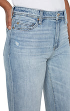 Load image into Gallery viewer, Meet The Tucker. The "Dad Jean" re-envisioned into a super cool girl jean. Loose and straight legged...clean, casual and tucked...always relaxed and cool. Give off a 90's vibe and pair them with some sneakers, chunky sandals or your favorite wedges! This modern eco jean was designed using new laser techniques and processes that gives the "Liverpool Look" and uses a fraction of our natural resources. Color -Animas; Light blue. 30'' Inseam. Hi-rise. Wide leg.