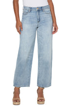 Load image into Gallery viewer, Meet The Tucker. The "Dad Jean" re-envisioned into a super cool girl jean. Loose and straight legged...clean, casual and tucked...always relaxed and cool. Give off a 90's vibe and pair them with some sneakers, chunky sandals or your favorite wedges! This modern eco jean was designed using new laser techniques and processes that gives the "Liverpool Look" and uses a fraction of our natural resources. Color -Animas; Light blue. 30'' Inseam. Hi-rise. Wide leg.