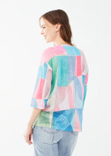 Load image into Gallery viewer, Embrace effortless style with FDJ French Dressing’s drop shoulder jersey top. Featuring a chic boat neckline, 3/4 sleeves, and a modern geo print in beautiful pastel colors, this lightweight, relaxed-fit piece adds a touch of elegance to any wardrobe. Perfect for casual outings or layering up in style!
