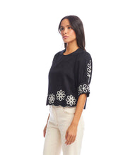 Load image into Gallery viewer, Add a touch of timeless elegance to your wardrobe with the Tesni Three Quarter Sleeve Embroidered Scallop Top by Karen Kane. Featuring delicate floral embroidery, a scalloped hem, and chic puff sleeves, this sophisticated blouse offers a graceful yet modern look for any occasion. Perfect for brunch, workdays, or an evening out, this lightweight embroidered top pairs effortlessly with jeans, skirts, or tailored pants.