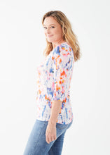 Load image into Gallery viewer, Get ready to dazzle and delight with the FDJ French Dressing Tawny Three Quarter V-Neck Top in a stunning Petal Reflections print. This top is all about effortless elegance and vibrant style, making it a standout piece in any wardrobe.