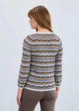 Load image into Gallery viewer, Woman wearing a striped sweater and brown pants against a light gray background.