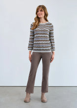 Load image into Gallery viewer, Woman wearing a striped sweater, grey pants and beige boots against a white background.