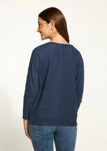 Load image into Gallery viewer, The Nessie Navy Batwing Top from FDJ French Dressing showcases intricate and vibrant floral details along the outer edge of the sleeves, adding an appealing and unique touch to any ensemble. The loose-fitting batwing design ensures a comfortable and stylish look, suitable for any occasion.
