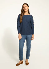 Load image into Gallery viewer, The Nessie Navy Batwing Top from FDJ French Dressing showcases intricate and vibrant floral details along the outer edge of the sleeves, adding an appealing and unique touch to any ensemble. The loose-fitting batwing design ensures a comfortable and stylish look, suitable for any occasion.