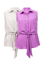 Load image into Gallery viewer, The fabrication used to create this gorgeous top by Joseph Ribkoff is absolutely amazing. The flowy texture and lightweight feel make it an ideal top for summer styling. A timeless design which includes button down with a fabric that softly drapes and then can be tied in the middle. Color- Moonstone. Self-tie. Button down. Sleeveless. No pockets. Not lined. Fabric - 100% Polyester.