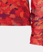 Load image into Gallery viewer, Who says winter has to be drab? Enhance your winter wardrobe with a touch of color. This stunning top features a vibrant multi color design that pairs well with denim or black pants. Wear it solo or layer it under a black blazer for a sophisticated look.