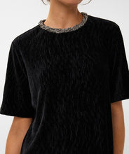 Load image into Gallery viewer, Woman wearing a black velvet short sleeve top with embellished neckline against a white background.