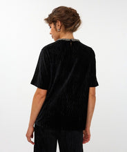 Load image into Gallery viewer, Woman wearing a black velvet top with embellished neckline and black velvet pants against a white background.