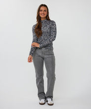 Load image into Gallery viewer, Woman wearing a snake print long-sleeve top, gray pants and white sneaker against a white background.
